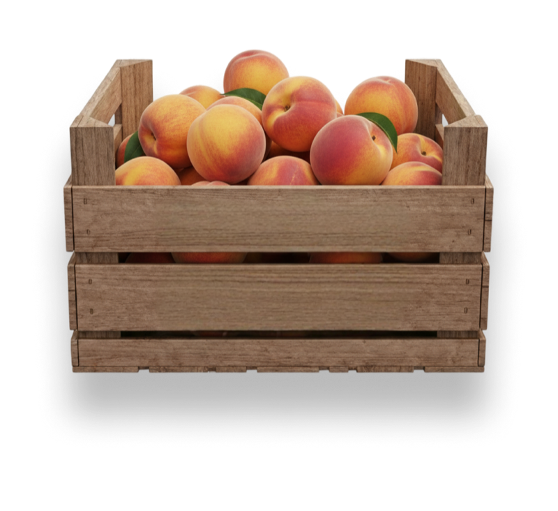 Fresh peaches in wooden crate